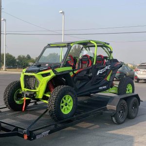 A jeep on TR614T Ramptek Trailer 77″ x 14′ Tandem