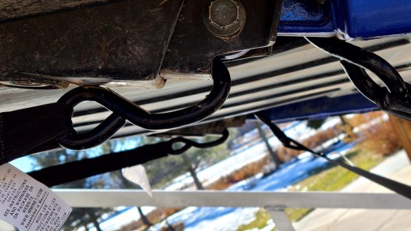 Rachet Straps connected to A Arms on left and right side of RZR