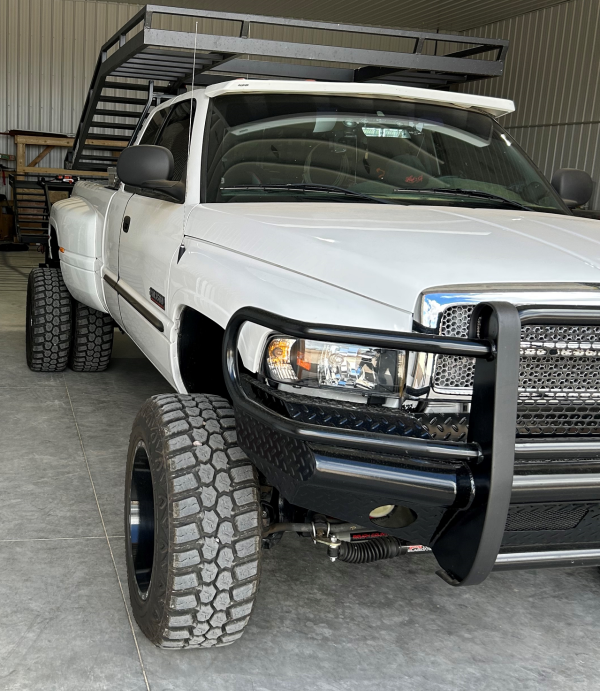 Front Right View of Dodge Dually with Truck Rack and Tool Box
